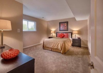 Large, carpeted bedroom with window at apartment for rent in Harleysville, PA