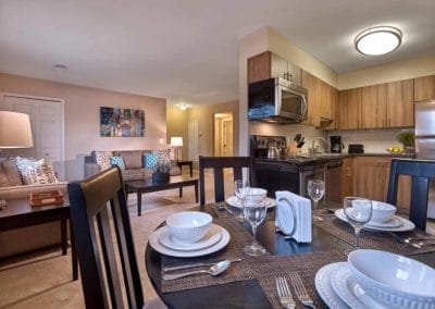 Open concept layout in Harleysville, PA apartments with large living room, dining area, and spacious kitchen