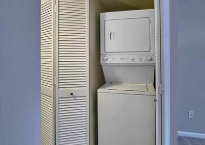 In-unit washer and dryer stacked inside a laundry closet