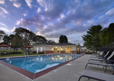 Sparkling pool at dusk at apartments for rent in Harleysville, PA