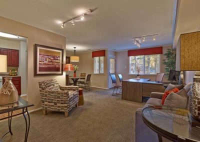 Modern furniture and warm colors decorate the leasing office at Haynes Run Apartments