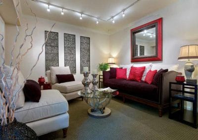 Cozy living room with carpeted floors and track lighting
