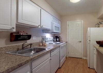 Kitchen with white cabinetry and appliances in apartment for rent in Marlton, NJ