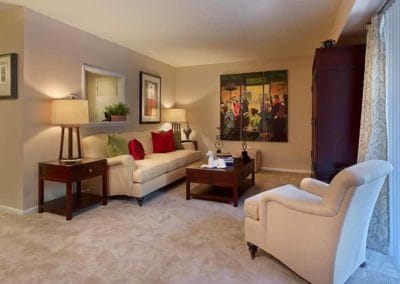 Spacious, furnished living room with carpeted floors in Marlton, NJ apartment for rent