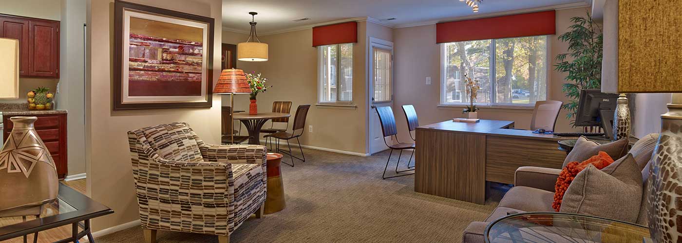 Leasing office with carpeted seating area at Haynes Run apartments in Medford, NJ