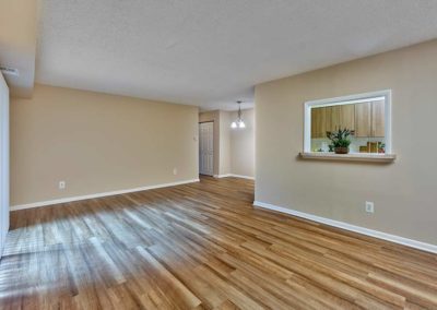 Large living area in Villager at Barton Run Apartments with new hardwood flooring