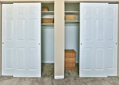 Large bedroom closets with shelving and plenty of storage space