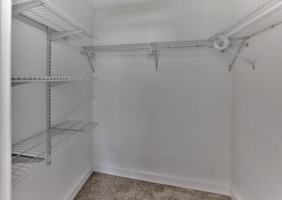 Huge walk-in close with shelving and clothing racks at Delmont Apartments in Wayne, PA