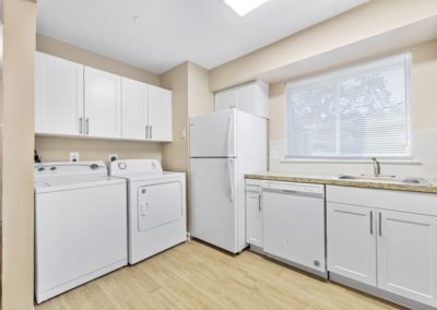 Spacious kitchen with laundry area